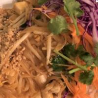 Pad Thai · Rice noodles, an egg, tofu, bean sprouts, green onions and chili powder topped with ground p...