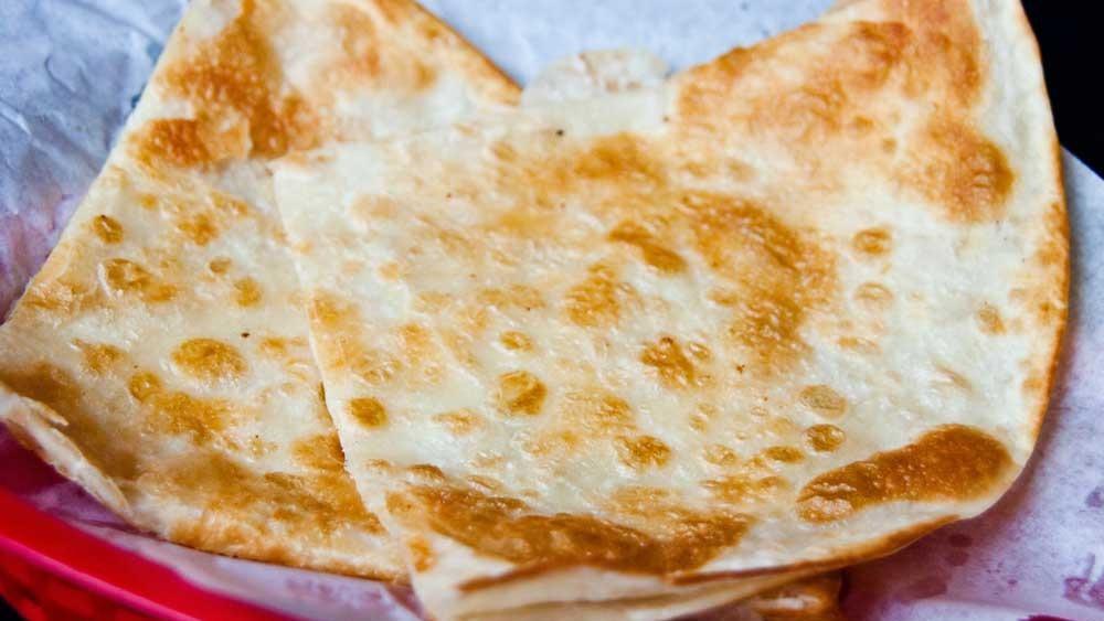 Poco Queso Quesadilla · Melted jack cheese folded in a crispy flour tortilla.