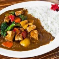 Tofu and Vegetable Curry · Fried tofu and steamed vegetables served with curry sauce, steamed rice, and house special p...