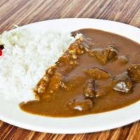 Beef Curry · Pieces of tender beef in curry sauce served with steamed rice and house special pickle.