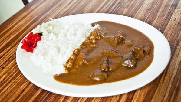 Beef Curry · Pieces of tender beef in curry sauce served with steamed rice and house special pickle.
