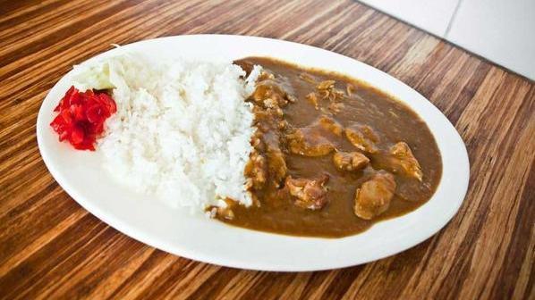 Chicken Curry · Pieces of grilled chicken in curry sauce served with steamed rice and house special pickles.