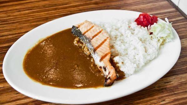 Salmon Curry · Grilled salmon served with curry sauce, steamed rice, and house special pickle.