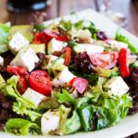 Mediterranean Salad · Fresh made salad with mix greens, cucumbers, diced tomatoes, olives, feta cheese and red oni...