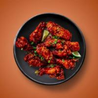 Korean Comfort · Six golden fried wings in a sticky and zesty Korean BBQ sauce. Served with a side of blue ch...