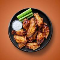 Naked Wings · Six golden fried wings succulent wings, served with a side of blue cheese or ranch.