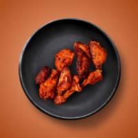 Chili Hot Wings · Six golden fried wings in a hot chili sauce. Served with a side of blue cheese or ranch.