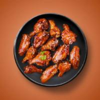 Angry Wings · Six golden fried wings in a hḝll sauce. Served with a side of blue cheese or ranch.