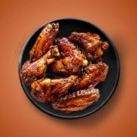 Wonder Wings · Six golden fried wings in a mild sauce. Served with a side of blue cheese or ranch.