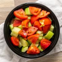 Kachumber Salad · Diced cucumber, vine ripened tomatoes, lettuce and homemade mango dressing.