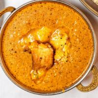 Fish Tikka Masala · Tandoori baked salmon fillets cooked in a smooth dairy curry with a touch of saffron with ba...