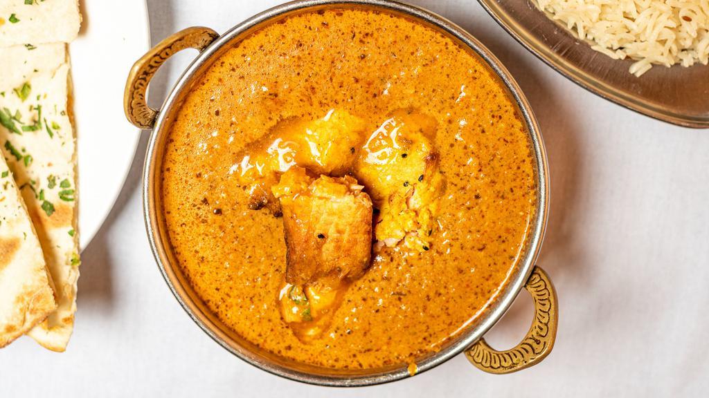 Fish Tikka Masala · Tandoori baked salmon fillets cooked in a smooth dairy curry with a touch of saffron with base gravy yellow and red onions, ginger, garlic, and vine ripened tomatoes with many more Indian famous spices.