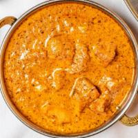 Chicken Tikka Masala · Tandoori baked chicken breast cooked in a smooth dairy curry with a touch of saffron with ye...