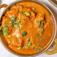 Lamb Curry · Boneless lamb cubes cooked in a gravy of garlic, ginger, lots of spices and red and white on...
