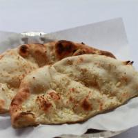 Garlic Naan · White flour bread garnished with freshly chopped garlic baked in tandoor.