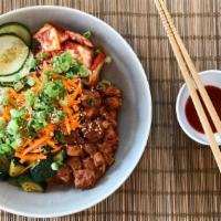The Seoul Heat · Spicy chicken over rice base, with kimchi, pickled cucumber, prepared zucchini, carrots and ...