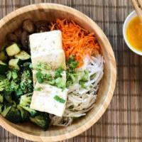 The Green · Fresh bed of crunchy romaine lettuce, topped with tofu, prepared zucchini, broccoli, pickled...