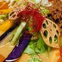 Vegan Curry  Ramen · Toppings : SoyBean Flakes, Spring Mix, Tomato, Eggplant, Bell Pepper, Green Onion, Lotus Roo...