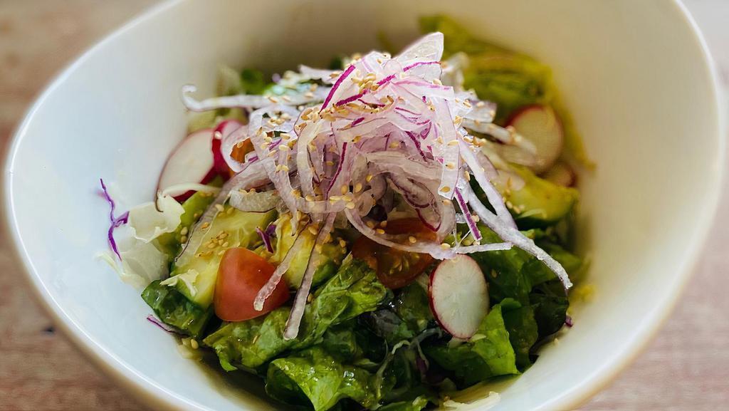 Green  Salad · Lettuce, cucumbers, avocado, cabbage, tomato, radish red onion and sesame with house made sesame oil base dressing.