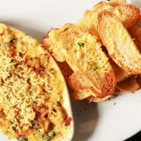 Artichoke Dip · Sautéed spinach, artichoke hearts & pepperoni, baked in cream & Italian cheeses. Served with...