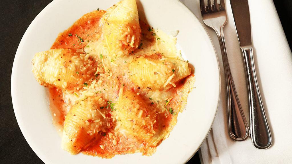Cheese Stuffed Shells · Jumbo shells stuffed with Italian cheeses, baked with Marinara and Alfredo sauces and Parmesan cheese.