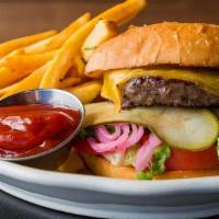 Americana Burger · beef patty, cheddar cheese, lettuce, tomato, pickled onions, pickles, and mayo on a bun. ser...