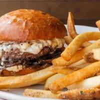 GLK Burger · beef patty, caramelized onions, mushrooms, blue cheese, on a bun served with french fries.  ...
