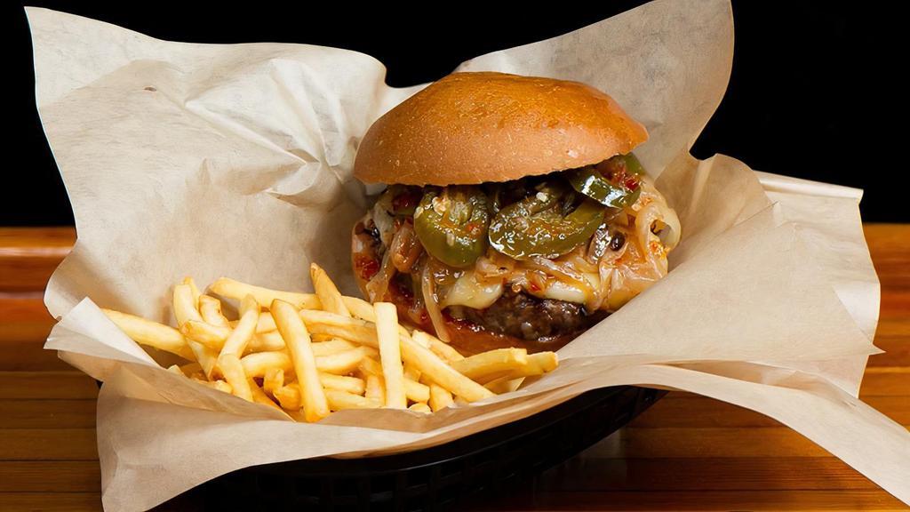 Brass Hat Burger · served Medium with caramelized onions, pepper jack cheese, pickled jalapenos, and sweet chili sauce