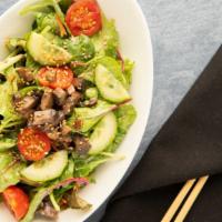 House Salad · Local Mixed Greens, Carrots, Tomatoes, Cucumber, Portabella Mushrooms, Eiko's sesame Dressing