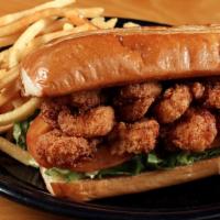 Brenda's Fried Seafood Po' Boy · Choose from cornmeal fried shrimp or catfish with lettuce, tomato, and chipotle remoulade.
