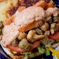 Fried Veggie Po' Boy · Cornmeal-fried cauliflower, yam and okra with lettuce, tomato, bread and butter pickles and ...
