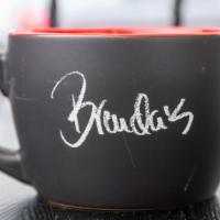 Giant Mug · Giant mug in black with red interior. Front has brenda's signature and back says 