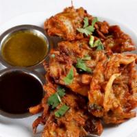 Mix Vegetable Pakora · Vegan. Onion fritter fried in chickpea batter served with chutney.
