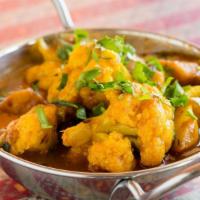 Aloo Gobi · Vegan. Pan fried potato, onions, and cauliflower served in a little house special curry sauce.