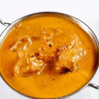 Chicken Korma · Boneless chicken cooked in a rich creamy curry sauce with nuts.