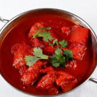 Chicken Vindaloo · Boneless chicken pieces and potatoes in a tomato based curry sauce with a touch of vinegar.