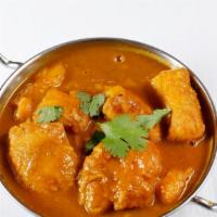Fish Curry · Sea bass cooked in our house special curry sauce.