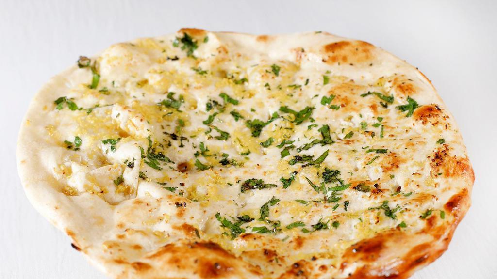 Plain Naan · Vegetarian. Traditional Indian flatbread made from flour.