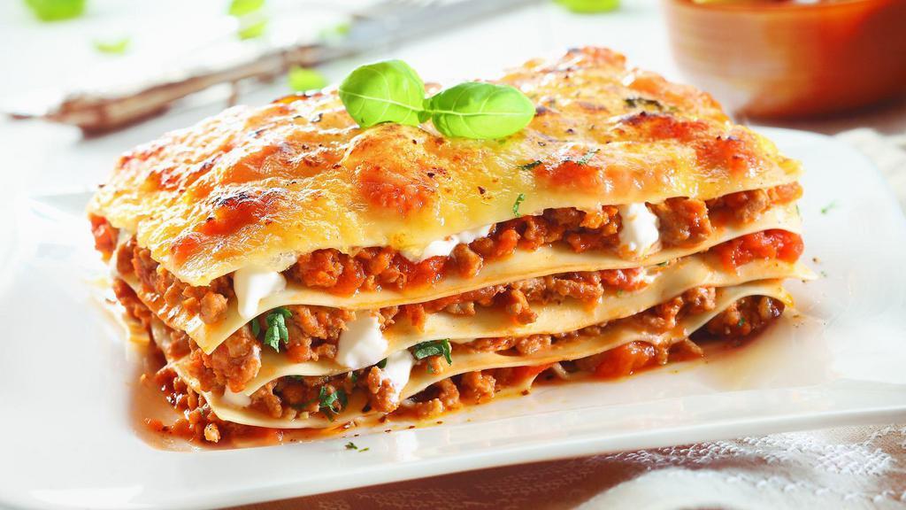 Meat Lasagna · Italian styled stacked lasagna made with fresh warm marinara sauce and beef.