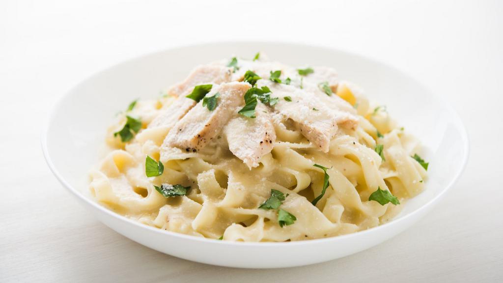 Alfredo Pasta with Chicken · Hearty grilled chicken and house-made creamy Alfredo sauce served over a bed fresh pasta.