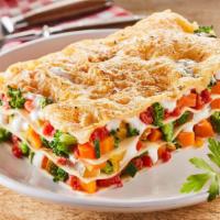 Veggie Lasagna · Italian styled stacked lasagna made with fresh warm marinara sauce and vegetables.