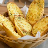 Garlic Bread With Cheese · Oven-baked bread topped with hints of and melted cheese.