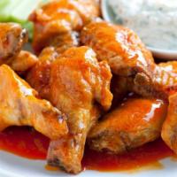 Crispy Chicken Wings · Choose Your Style:
Buffalo Sriracha Sauce
 or Chipotle BBQ