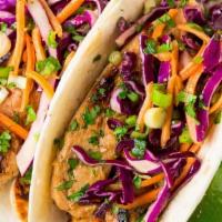 2 Grilled Chicken Tacos · Cabbage Slaw | Chipotle Aioli | Tomatillo Salsa