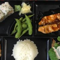 Lunch Bento E · Grilled fillet salmon in teriyaki sauce .Comes with miso soup, salad, rice, 2pc-gyoza,  edam...