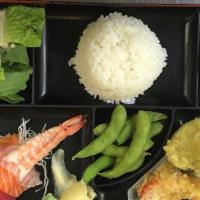 Lunch Bento G · 4pc assortment sashimi .Comes with miso soup, salad, rice, 2pc-gyoza,  edamame and  5pc-temp...