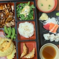 Deluxe Bento A · Grilled chicken in teriyaki sauce. Comes with miso soup, salad, white steam rice, 2pc gyoza,...