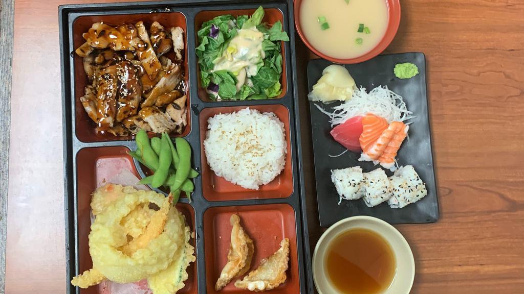 Deluxe Bento A · Grilled chicken in teriyaki sauce. Comes with miso soup, salad, white steam rice, 2pc gyoza, edamame, 5pc-tempura, 3pc-cal roll, 3pc- assortment sashimi