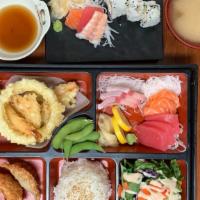 Deluxe Bento G · 9 pc: Fresh assorted thin slice fish. Comes with miso soup, salad, white steam rice, 2pc gyo...