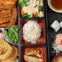 Deluxe Bento C · Battered crunchy chicken cutlet served with katsu sauce. Comes with miso soup, salad, white ...